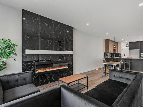 9823 107A Avenue, Morinville, AB - Indoor Photo Showing Living Room With Fireplace