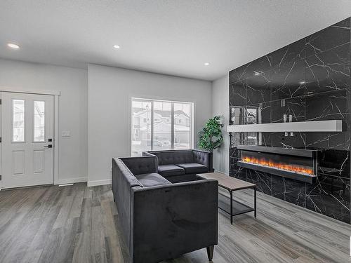 9823 107A Avenue, Morinville, AB - Indoor Photo Showing Living Room With Fireplace