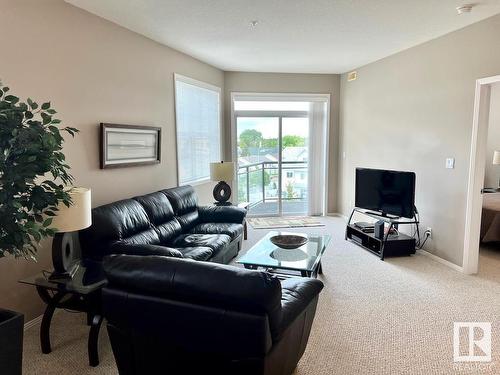 400 9940 Sherridon Drive, Fort Saskatchewan, AB - Indoor Photo Showing Living Room