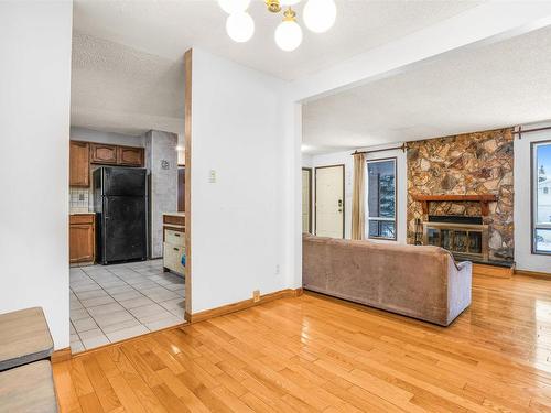 6327 12 Avenue, Edmonton, AB - Indoor Photo Showing Other Room With Fireplace