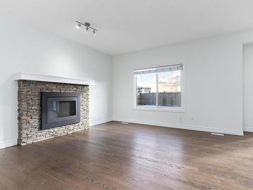 2805 16A Avenue, Edmonton, AB - Indoor Photo Showing Living Room With Fireplace