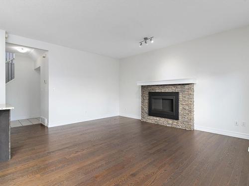 2805 16A Avenue, Edmonton, AB - Indoor Photo Showing Living Room With Fireplace