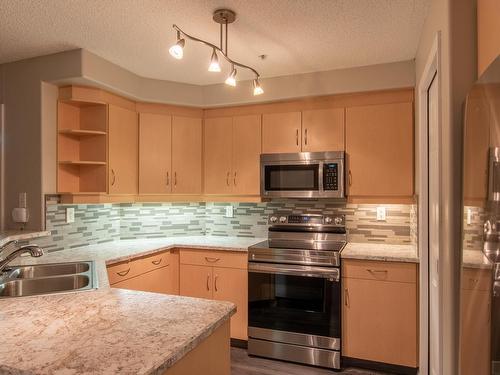 140 9704 174 Street, Edmonton, AB - Indoor Photo Showing Kitchen With Double Sink