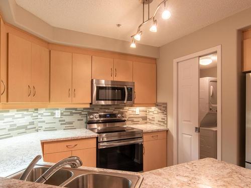 140 9704 174 Street, Edmonton, AB - Indoor Photo Showing Kitchen With Double Sink