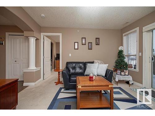 304 5204 52 Avenue, Tofield, AB - Indoor Photo Showing Living Room