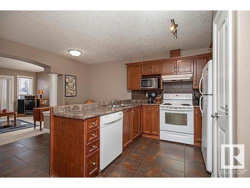 304 5204 52 Avenue, Tofield, AB - Indoor Photo Showing Kitchen With Double Sink