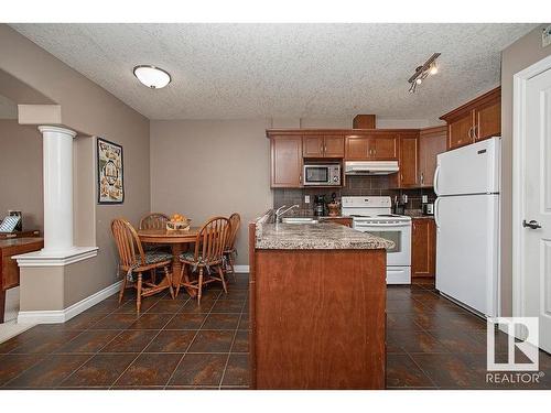 304 5204 52 Avenue, Tofield, AB - Indoor Photo Showing Kitchen