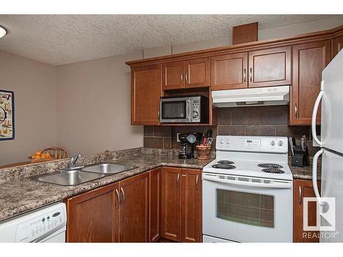 304 5204 52 Avenue, Tofield, AB - Indoor Photo Showing Kitchen With Double Sink