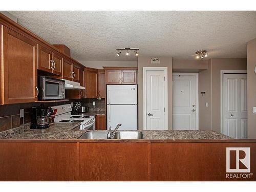 304 5204 52 Avenue, Tofield, AB - Indoor Photo Showing Kitchen With Double Sink