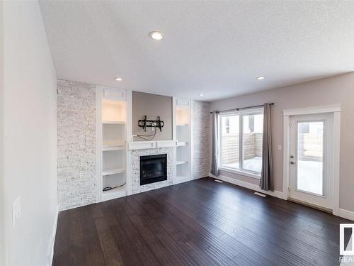 16231 138 St Nw, Edmonton, AB - Indoor Photo Showing Living Room With Fireplace