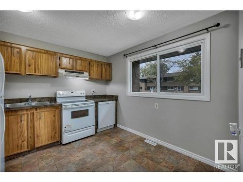 1626 37 Street, Edmonton, AB - Indoor Photo Showing Kitchen With Double Sink