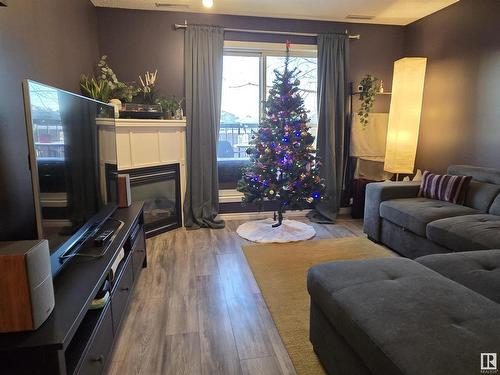 107 2098 Blackmud Creek Drive, Edmonton, AB - Indoor Photo Showing Living Room With Fireplace