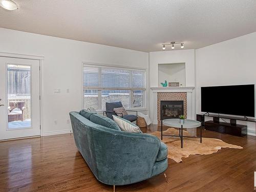 127 89 Rue Monette, Beaumont, AB - Indoor Photo Showing Living Room With Fireplace