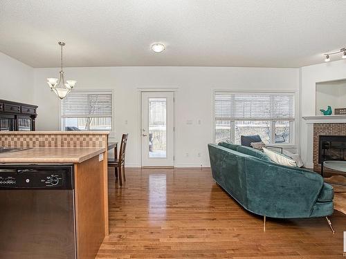 127 89 Rue Monette, Beaumont, AB - Indoor Photo Showing Living Room With Fireplace