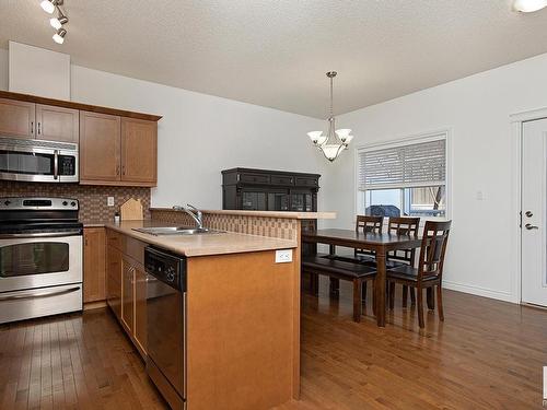 127 89 Rue Monette, Beaumont, AB - Indoor Photo Showing Kitchen With Double Sink