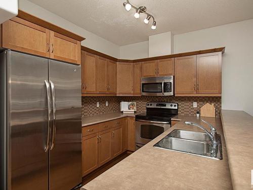 127 89 Rue Monette, Beaumont, AB - Indoor Photo Showing Kitchen With Double Sink