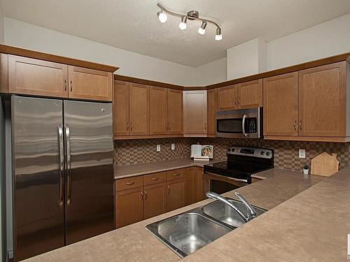 127 89 Rue Monette, Beaumont, AB - Indoor Photo Showing Kitchen With Double Sink