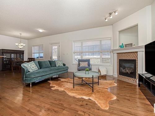 127 89 Rue Monette, Beaumont, AB - Indoor Photo Showing Living Room With Fireplace