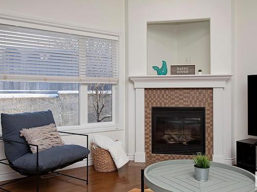 127 89 Rue Monette, Beaumont, AB - Indoor Photo Showing Living Room With Fireplace