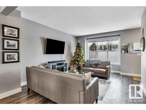 2114 24 Street, Edmonton, AB - Indoor Photo Showing Living Room With Fireplace