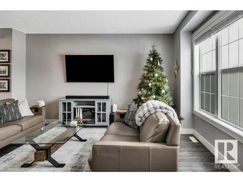 2114 24 Street, Edmonton, AB - Indoor Photo Showing Living Room With Fireplace