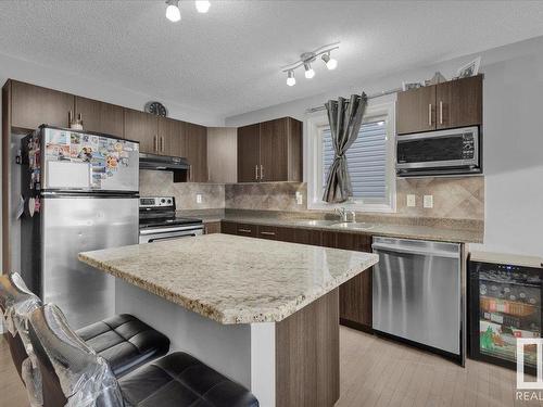 89 Keystone Crescent, Leduc, AB - Indoor Photo Showing Kitchen With Stainless Steel Kitchen With Double Sink With Upgraded Kitchen