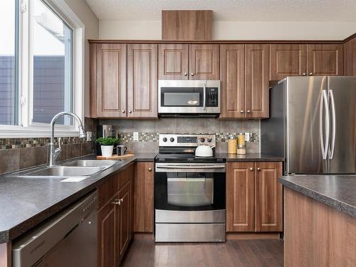 205 Sturtz Bend, Leduc, AB - Indoor Photo Showing Kitchen With Stainless Steel Kitchen With Double Sink