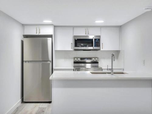 11345 111 Avenue, Edmonton, AB - Indoor Photo Showing Kitchen With Double Sink