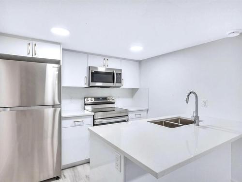 11345 111 Avenue, Edmonton, AB - Indoor Photo Showing Kitchen With Double Sink With Upgraded Kitchen