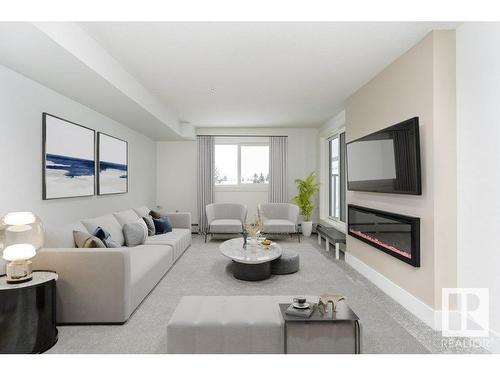 308 9504 182 Street, Edmonton, AB - Indoor Photo Showing Living Room With Fireplace