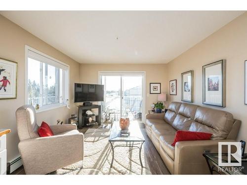 320 7511 171 Street, Edmonton, AB - Indoor Photo Showing Living Room With Fireplace