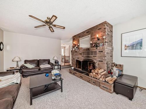 27 52212 Rge Road 274 Nw, Rural Parkland County, AB - Indoor Photo Showing Living Room With Fireplace