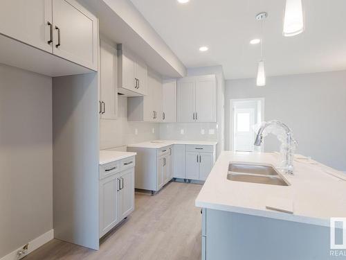 7127 52 Avenue, Beaumont, AB - Indoor Photo Showing Kitchen With Double Sink