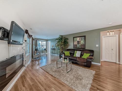 111 530 Hooke Road, Edmonton, AB - Indoor Photo Showing Living Room With Fireplace