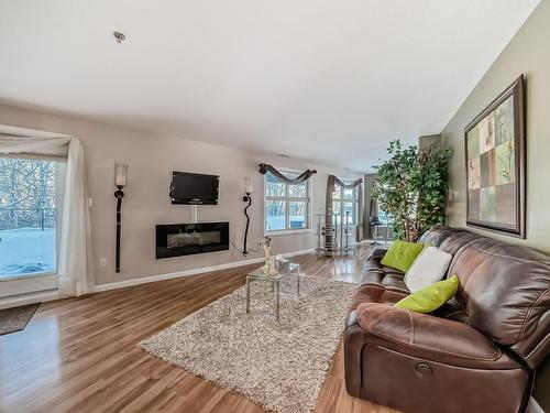 111 530 Hooke Road, Edmonton, AB - Indoor Photo Showing Living Room With Fireplace