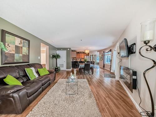 111 530 Hooke Road, Edmonton, AB - Indoor Photo Showing Living Room With Fireplace