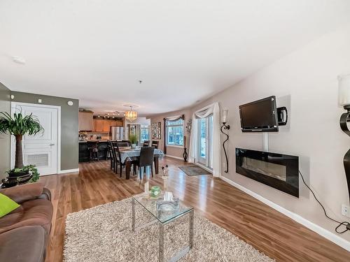 111 530 Hooke Road, Edmonton, AB - Indoor Photo Showing Living Room With Fireplace