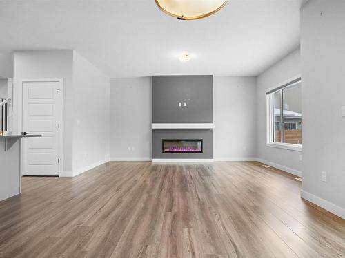 6 Kingsbury Circle, Spruce Grove, AB - Indoor Photo Showing Living Room With Fireplace