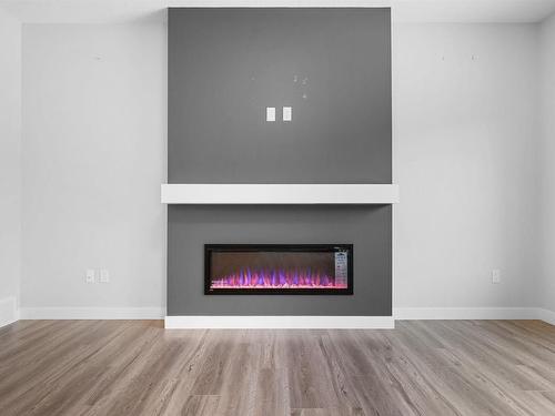 6 Kingsbury Circle, Spruce Grove, AB - Indoor Photo Showing Living Room With Fireplace