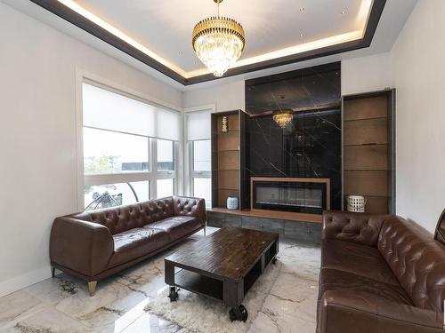 5106 Woolsey Link, Edmonton, AB - Indoor Photo Showing Living Room With Fireplace