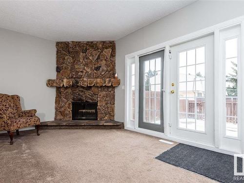 9105 Morinville Drive, Morinville, AB - Indoor Photo Showing Living Room With Fireplace