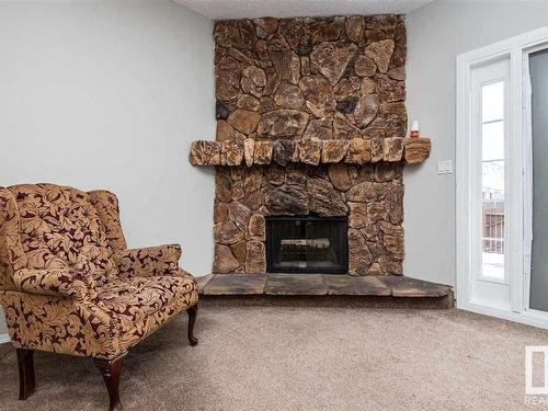 9105 Morinville Drive, Morinville, AB - Indoor Photo Showing Living Room With Fireplace