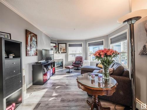 310 9938 104 Street, Edmonton, AB - Indoor Photo Showing Living Room With Fireplace