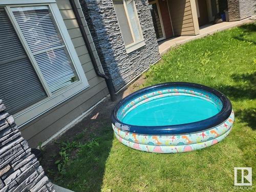 120 3315 James Mowatt Trail, Edmonton, AB - Outdoor With Above Ground Pool