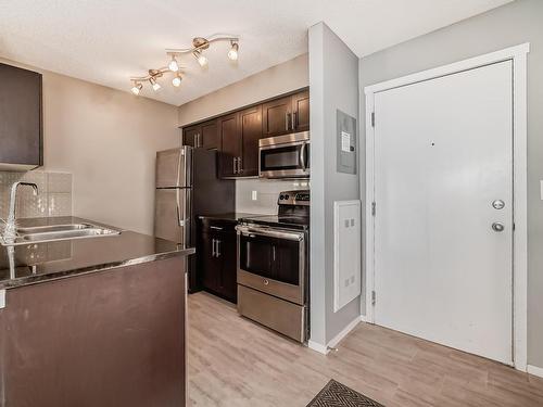 120 3315 James Mowatt Trail, Edmonton, AB - Indoor Photo Showing Kitchen With Stainless Steel Kitchen With Double Sink