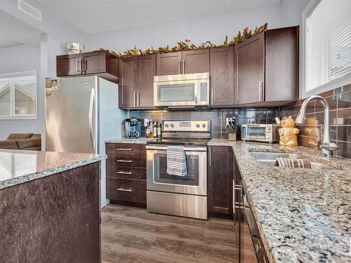 32 6520 2 Avenue Sw, Edmonton, AB - Indoor Photo Showing Kitchen With Double Sink With Upgraded Kitchen