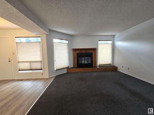 3582 42 Street Nw, Edmonton, AB - Indoor Photo Showing Other Room With Fireplace