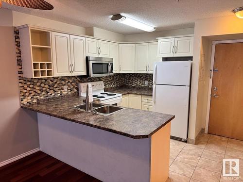 Edmonton, AB - Indoor Photo Showing Kitchen With Double Sink