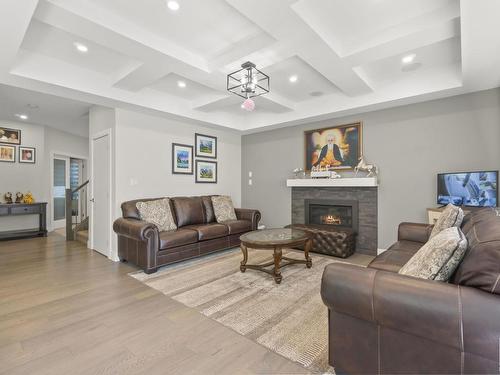 3009 Soleil Boulevard, Beaumont, AB - Indoor Photo Showing Living Room With Fireplace