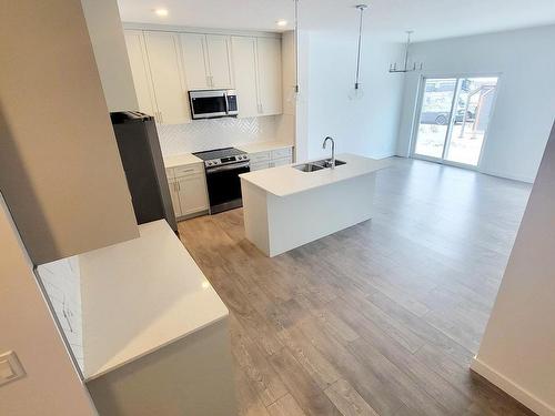 140 Rancher Road, Ardrossan, AB - Indoor Photo Showing Kitchen With Double Sink